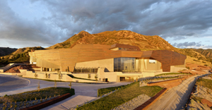  The setting sun illuminates the copper façade on the Natural History Museum of Utah’s new building, the Rio Tinto Center. The copper, mined at Kennecott Utah Copper, is offset in sections to represent Utah’s geologic formations. Image courtesy of NHMU/Stuart Ruckman.